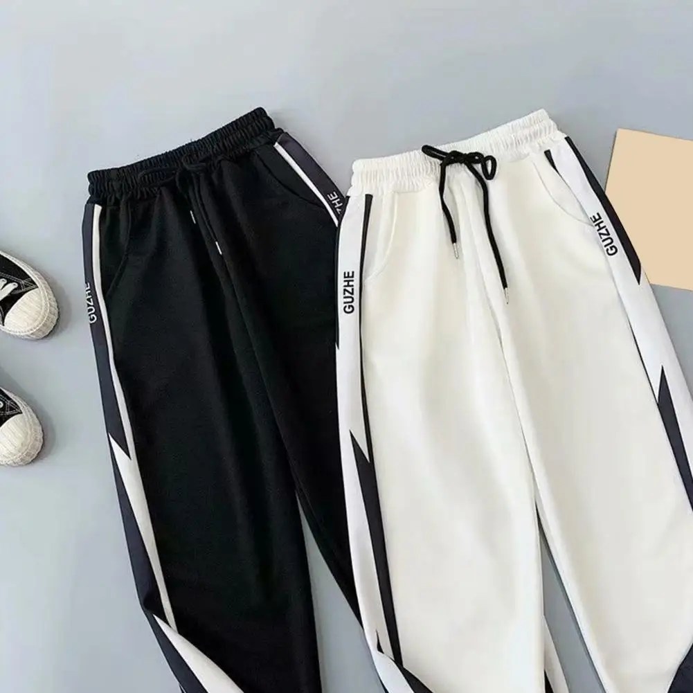 Şık erkekler Sweatpants kontrast renk soyunma dipleri rahat Fit cepler pantolon
